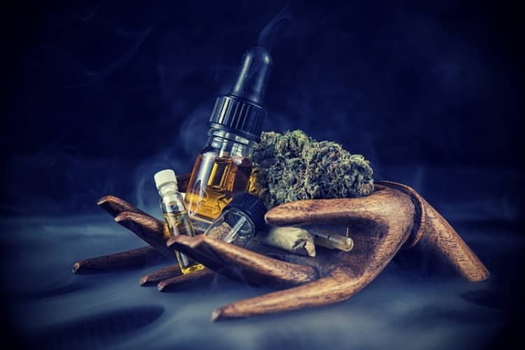 Assorted cannabis oil containers with CBD, nugs, live resin and other thc extractions - medical marijuana concept Assorted cannabis oil containers with CBD, nugs, live resin and other thc extractions - medical marijuana concept