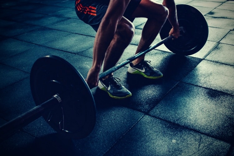 Person holding barbell